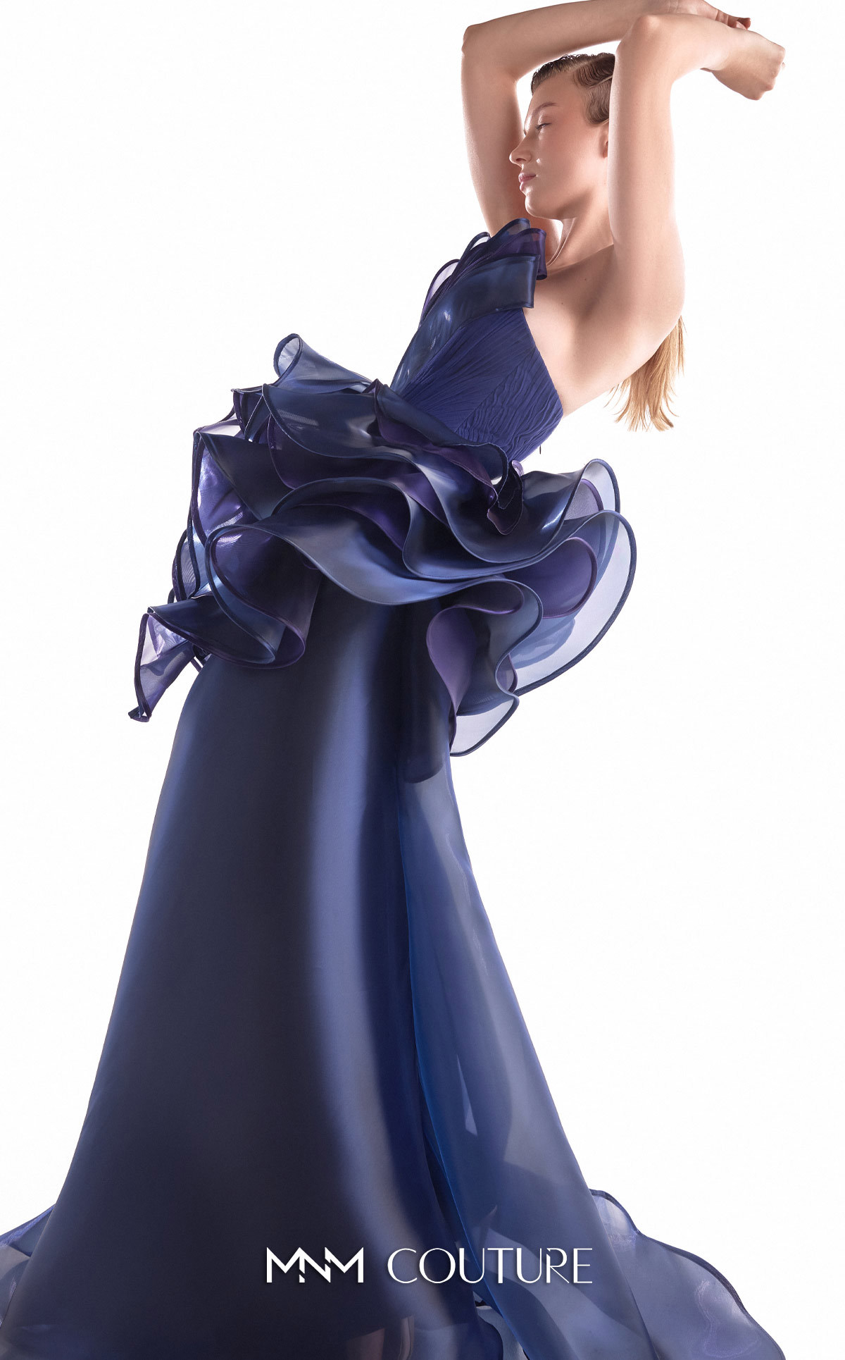 MNM Couture G2146 Strapless evening gown with cascading purple and navy fluid organza, a 3D floral waist bloom, and a sheer skirt